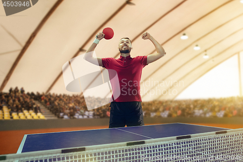 Image of The table tennis player celebrating victory