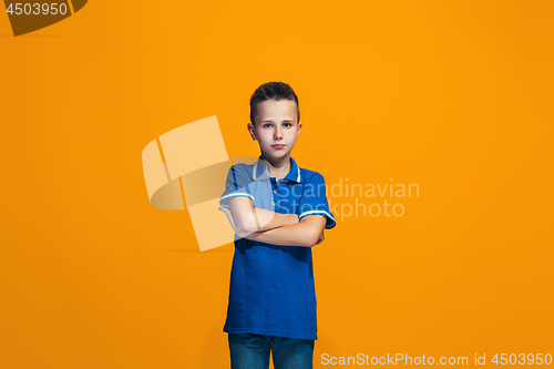 Image of Young serious thoughtful teen boy. Doubt concept.