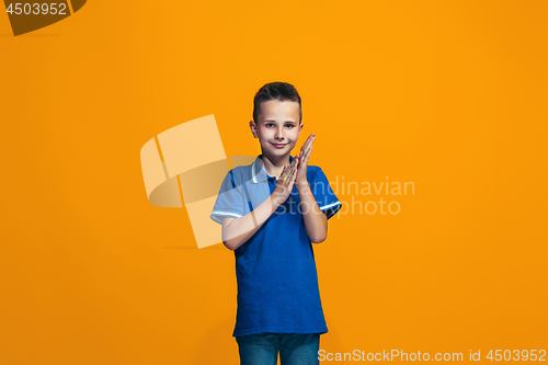 Image of Young serious thoughtful teen boy. Doubt concept.