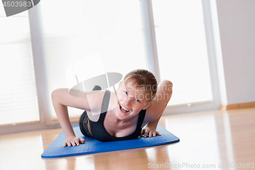 Image of Girl doing pushups exercises