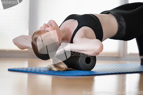 Image of Girl with fascia roll