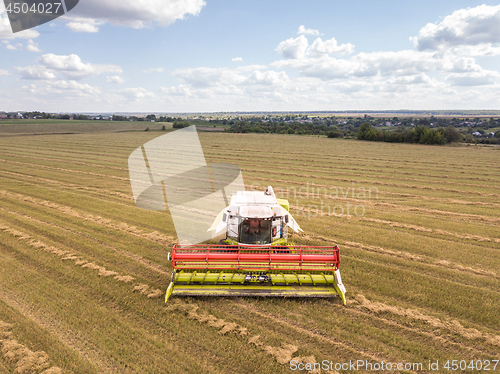 Image of Agricultural machinery on a a farm land after harvesting in asum