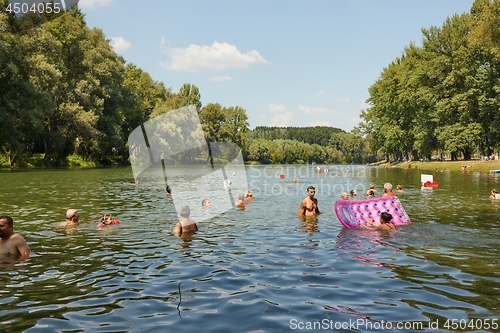 Image of River beach with people