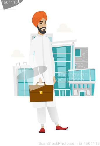 Image of Hindu businessman holding briefcase.