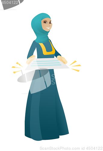 Image of Muslim business woman holding a contract.