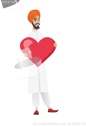 Image of Hindu businessman holding a big red heart.
