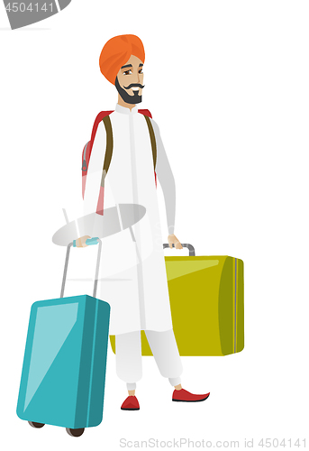 Image of Young hindu man traveler with many suitcases.