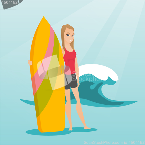 Image of Young caucasian surfer holding a surfboard.