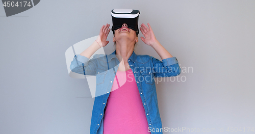 Image of girl using VR headset glasses of virtual reality