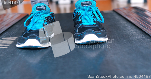 Image of black female feet in sneakers