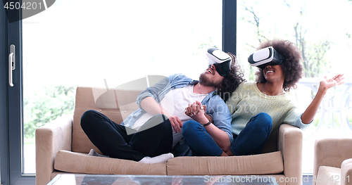 Image of Multiethnic Couple using virtual reality headset