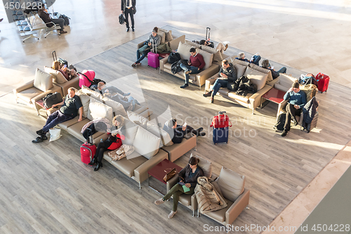 Image of People waiting for their flight at departure terminal of Valencia Airport in Manises, also known as Manises Airport