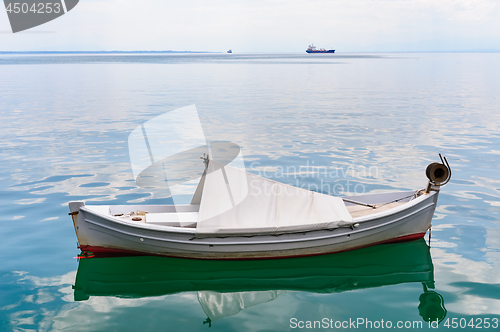 Image of Small fishing boat at sea surface