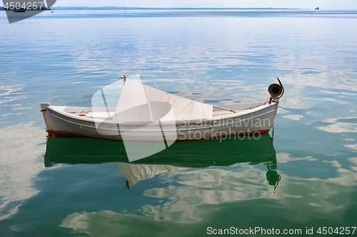Image of Small fishing boat at sea surface