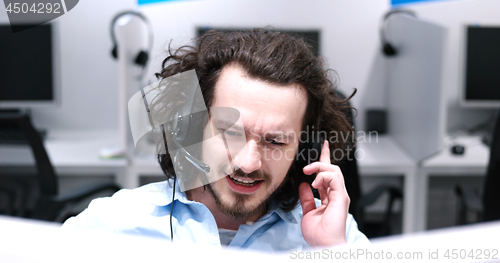 Image of male call centre operator doing his job