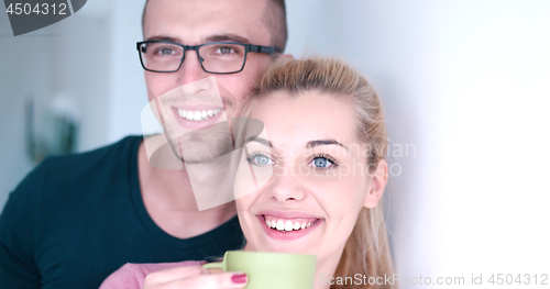 Image of young couple enjoying morning coffee