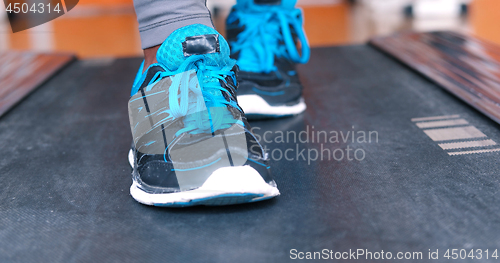 Image of black female feet in sneakers