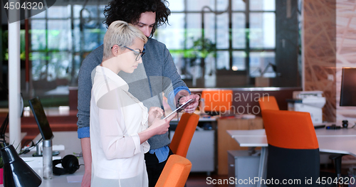 Image of Business People Working With Tablet in office