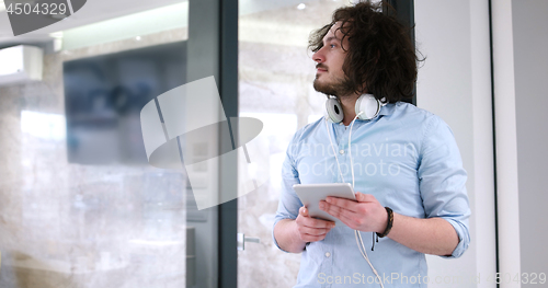 Image of businessman using tablet computer