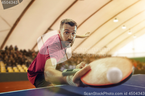 Image of The table tennis player serving