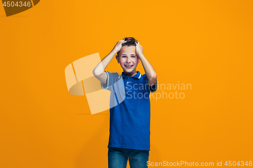 Image of Happy success teen boy celebrating being a winner. Dynamic energetic image of female model