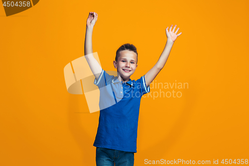 Image of Happy success teen boy celebrating being a winner. Dynamic energetic image of female model