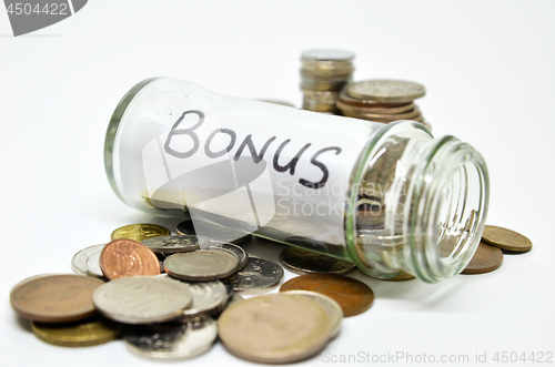 Image of Bonus lable in a glass jar with coins spilling out