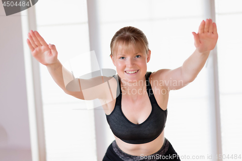 Image of Girl doing squat exercises