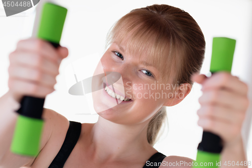 Image of Girl doing dumbbell exercises