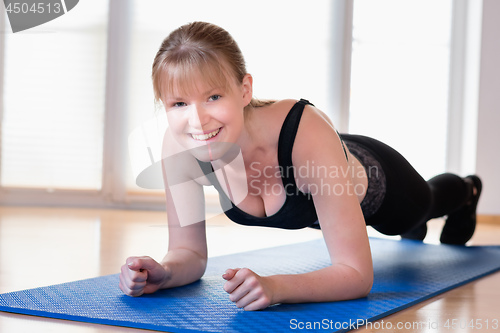 Image of Girl doing plank exercises