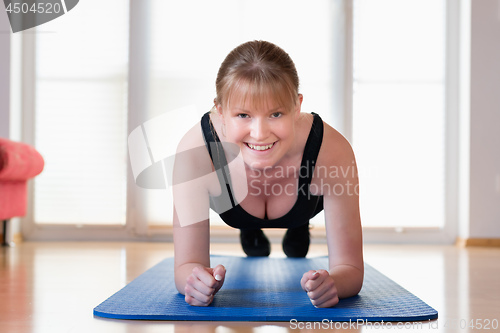 Image of Girl doing plank exercises