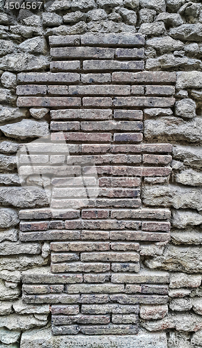 Image of Ancient wall with bricks and cobblestones