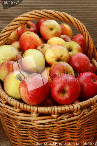 Image of Bright tasty ripe apples in a basket