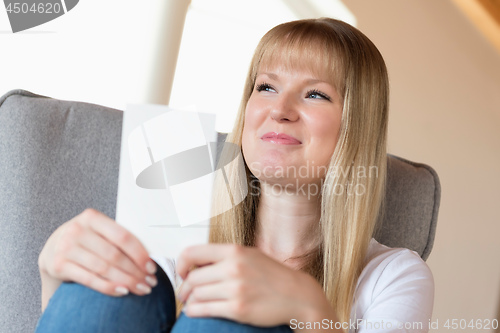 Image of Woman holding photo