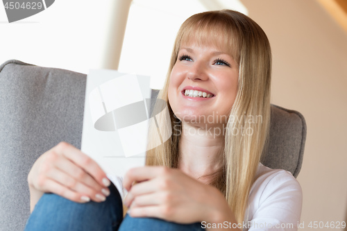 Image of Woman holding photo