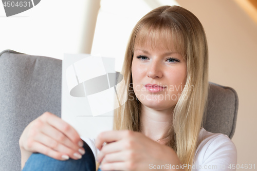 Image of Woman holding photo