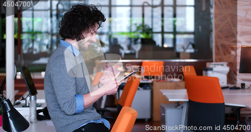 Image of businessman using tablet computer