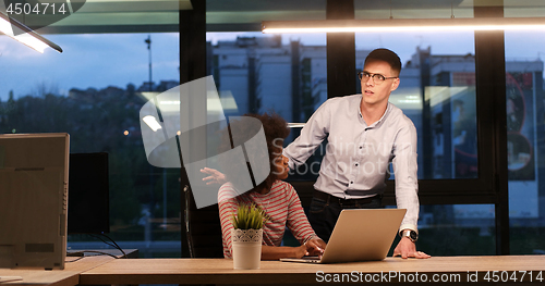 Image of Multiethnic startup business team in night office