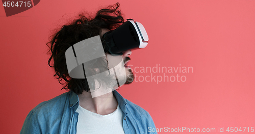 Image of young man using VR headset glasses of virtual reality