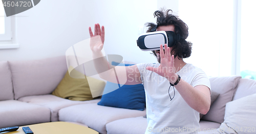 Image of man using VR-headset glasses of virtual reality