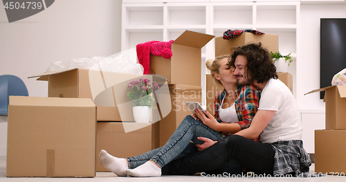 Image of young couple moving  in new house