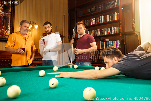 Image of Close-up shot of a man playing billiard