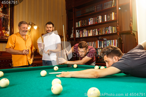 Image of Close-up shot of a man playing billiard