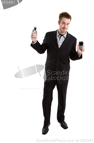 Image of Caucasian businessman with cell phones