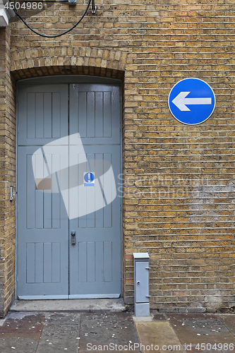 Image of Arrow and Door