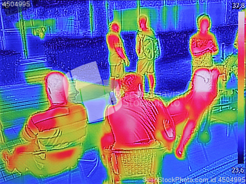 Image of Infrared thermovision image showing when People sit at the table