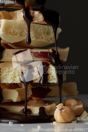 Image of syrop pouring onto a piece of chocolate