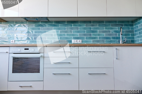 Image of Interior of a small white kitchen