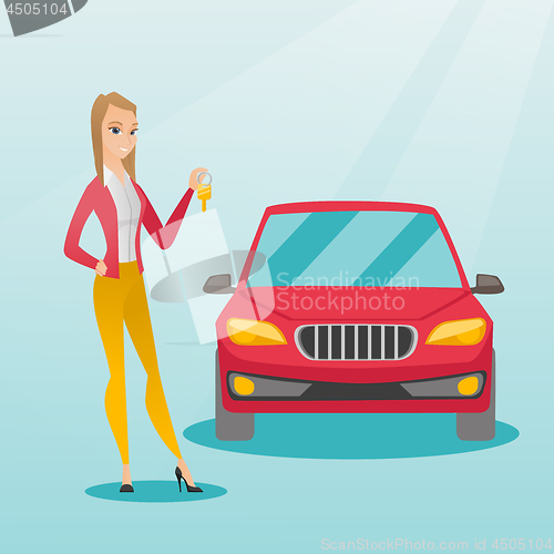 Image of Woman holding keys to her new car.