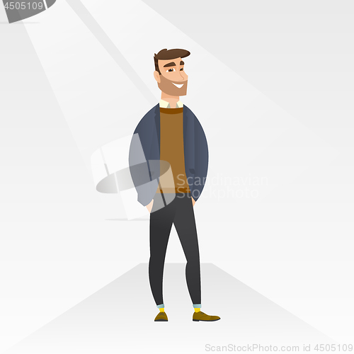 Image of Man posing on catwalk during fashion show.